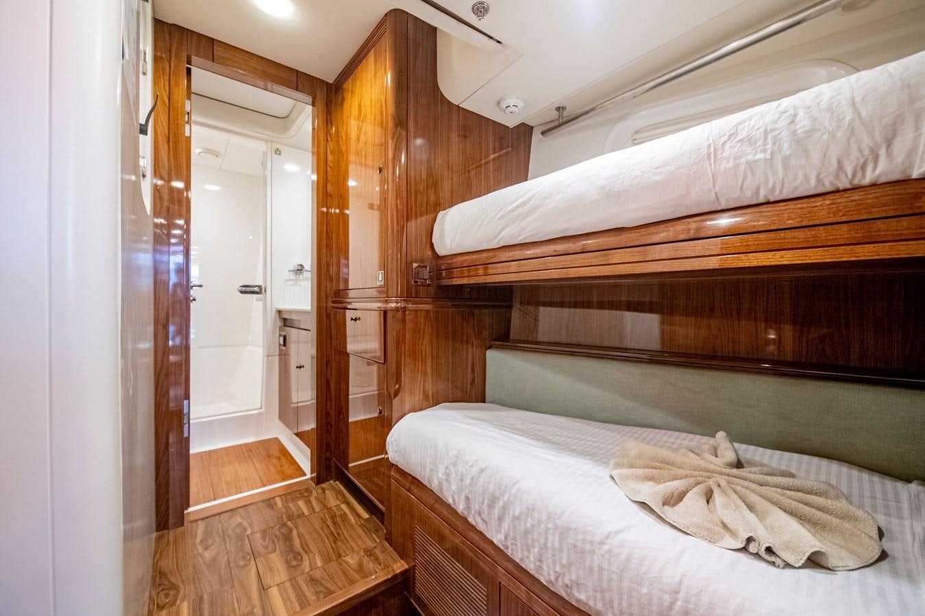 a room with a bed and a closet aboard SERAFIM Yacht for Sale