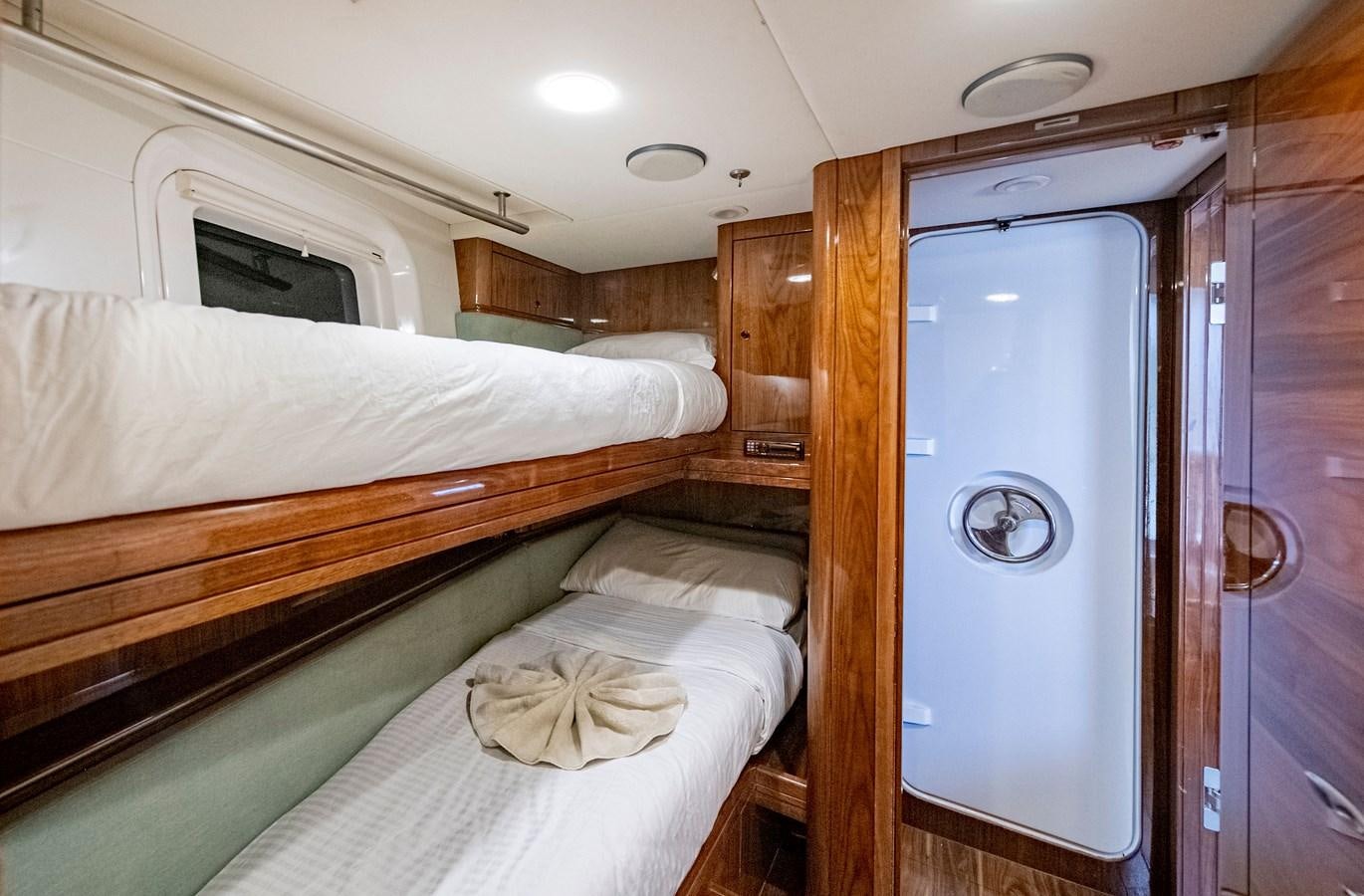a room with a bed and a closet aboard SERAFIM Yacht for Sale