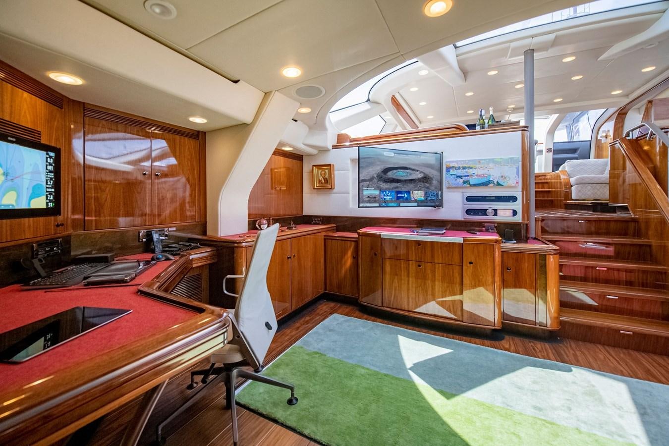 a large room with a pool table and a television aboard SERAFIM Yacht for Sale