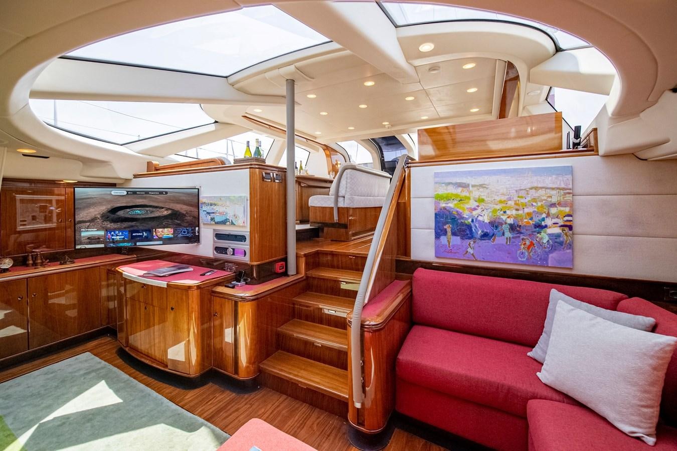 a room with a couch and a table aboard SERAFIM Yacht for Sale