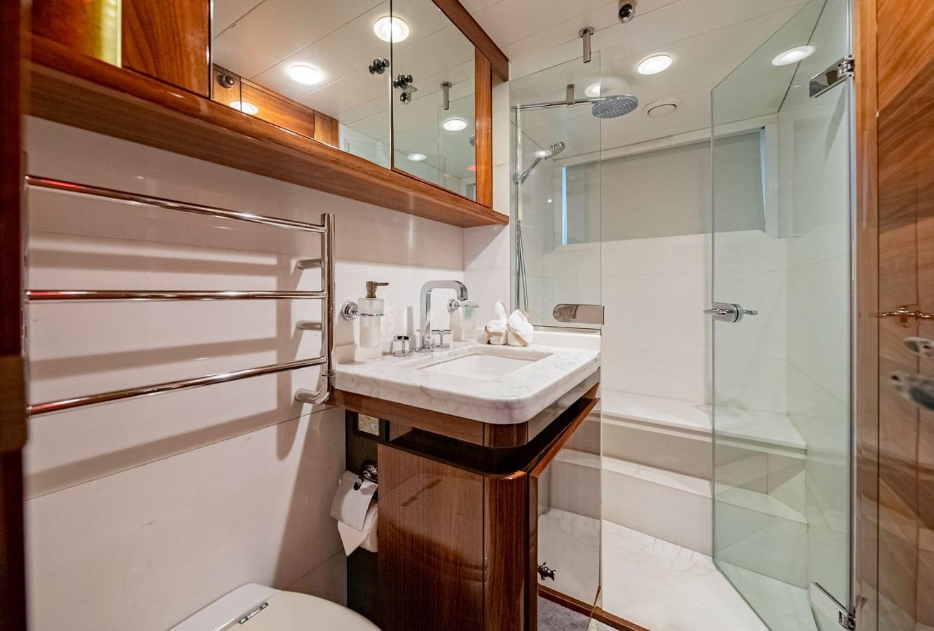 a bathroom with a glass shower aboard SERAFIM Yacht for Sale