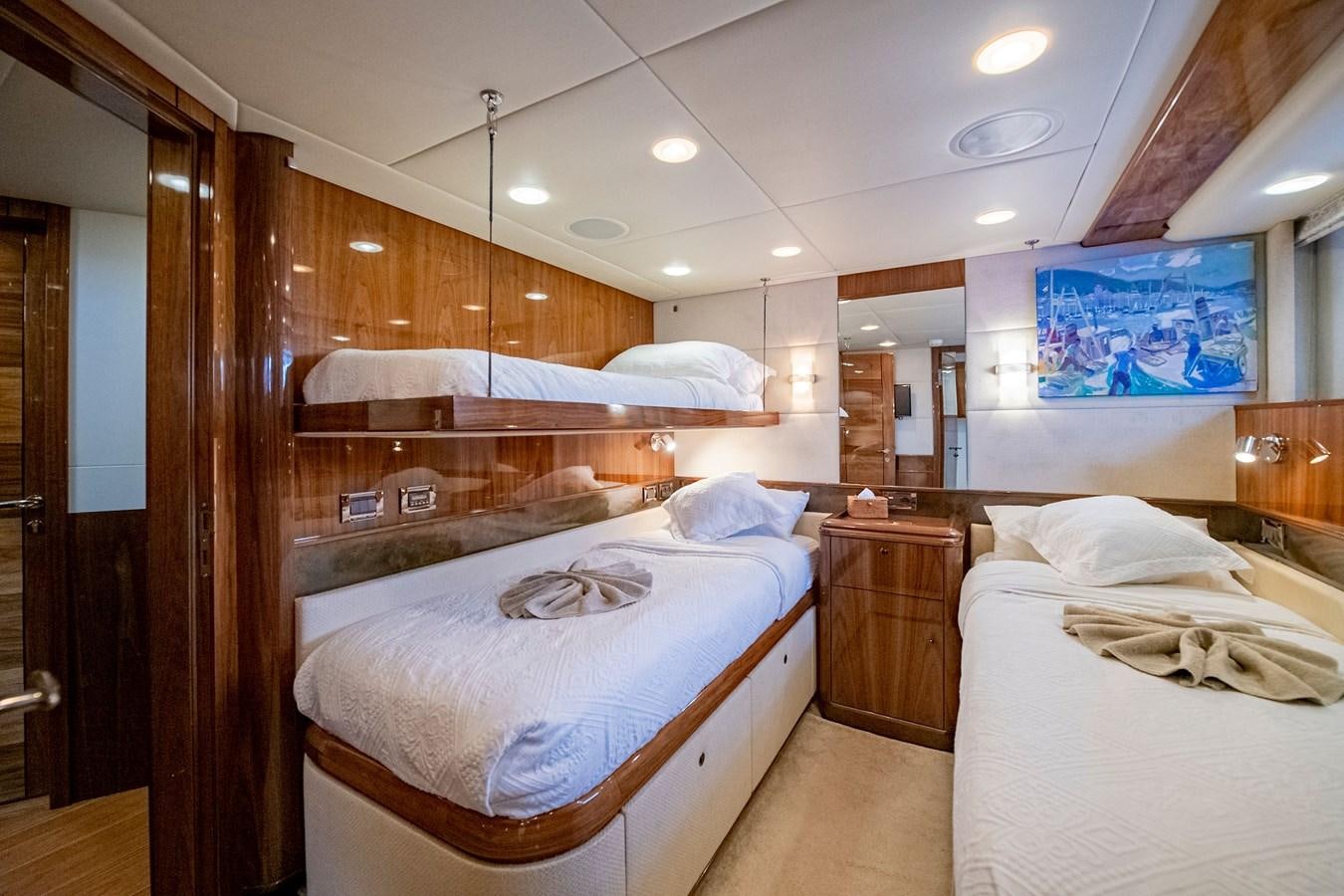 a room with a couple of beds aboard SERAFIM Yacht for Sale