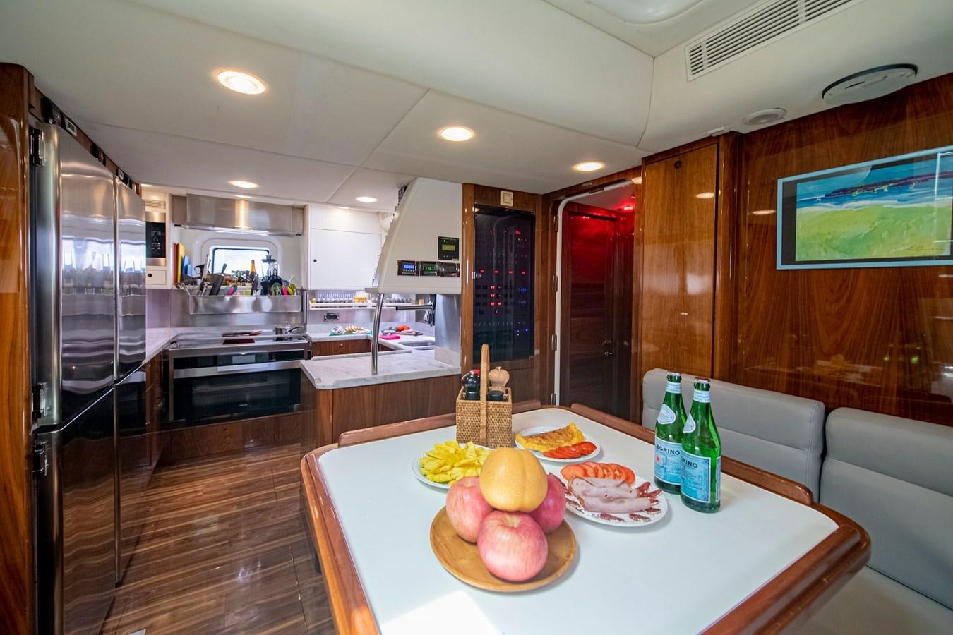 a kitchen with a table and food aboard SERAFIM Yacht for Sale