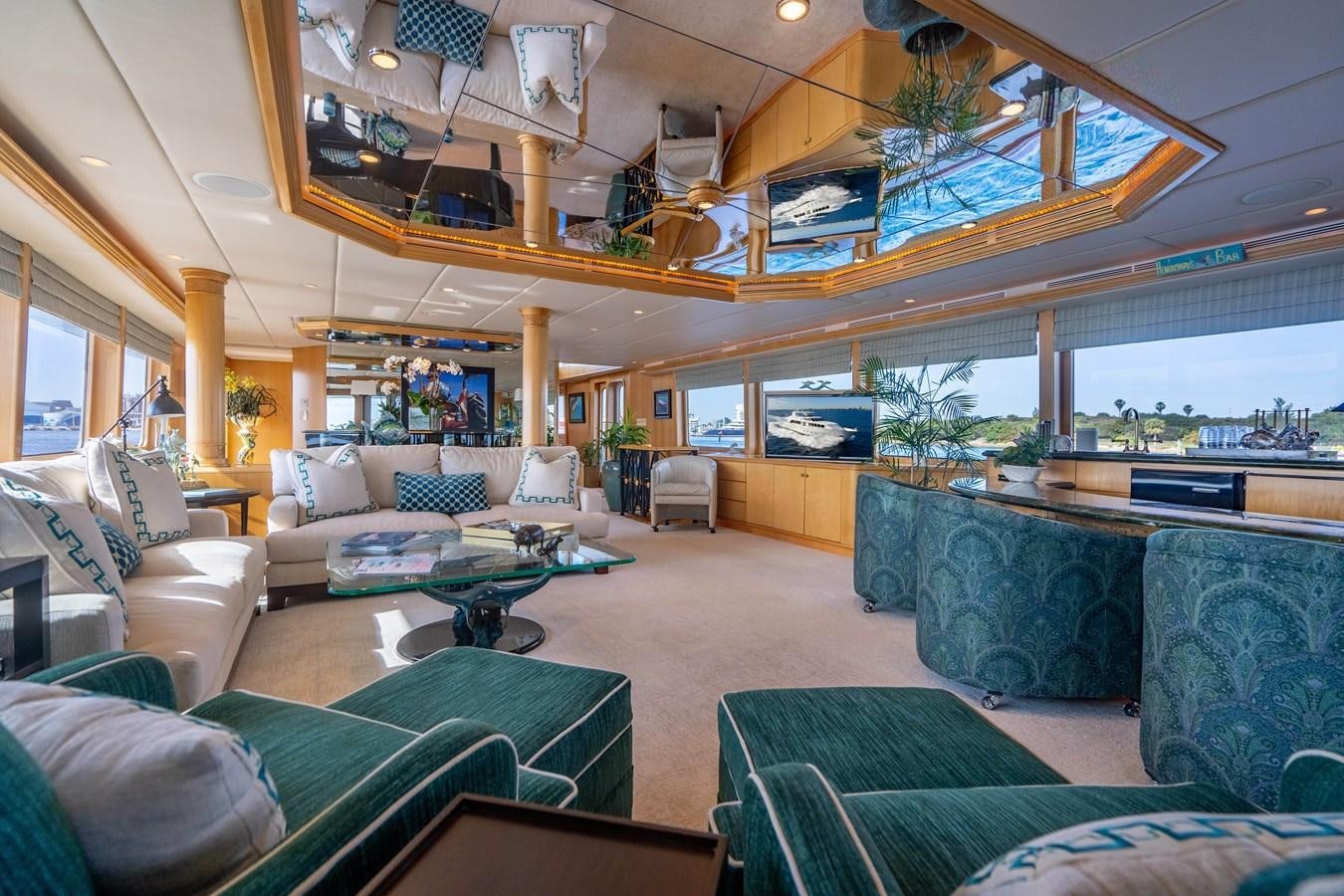 a living room with a large glass ceiling aboard SEA DREAMS Yacht for Sale
