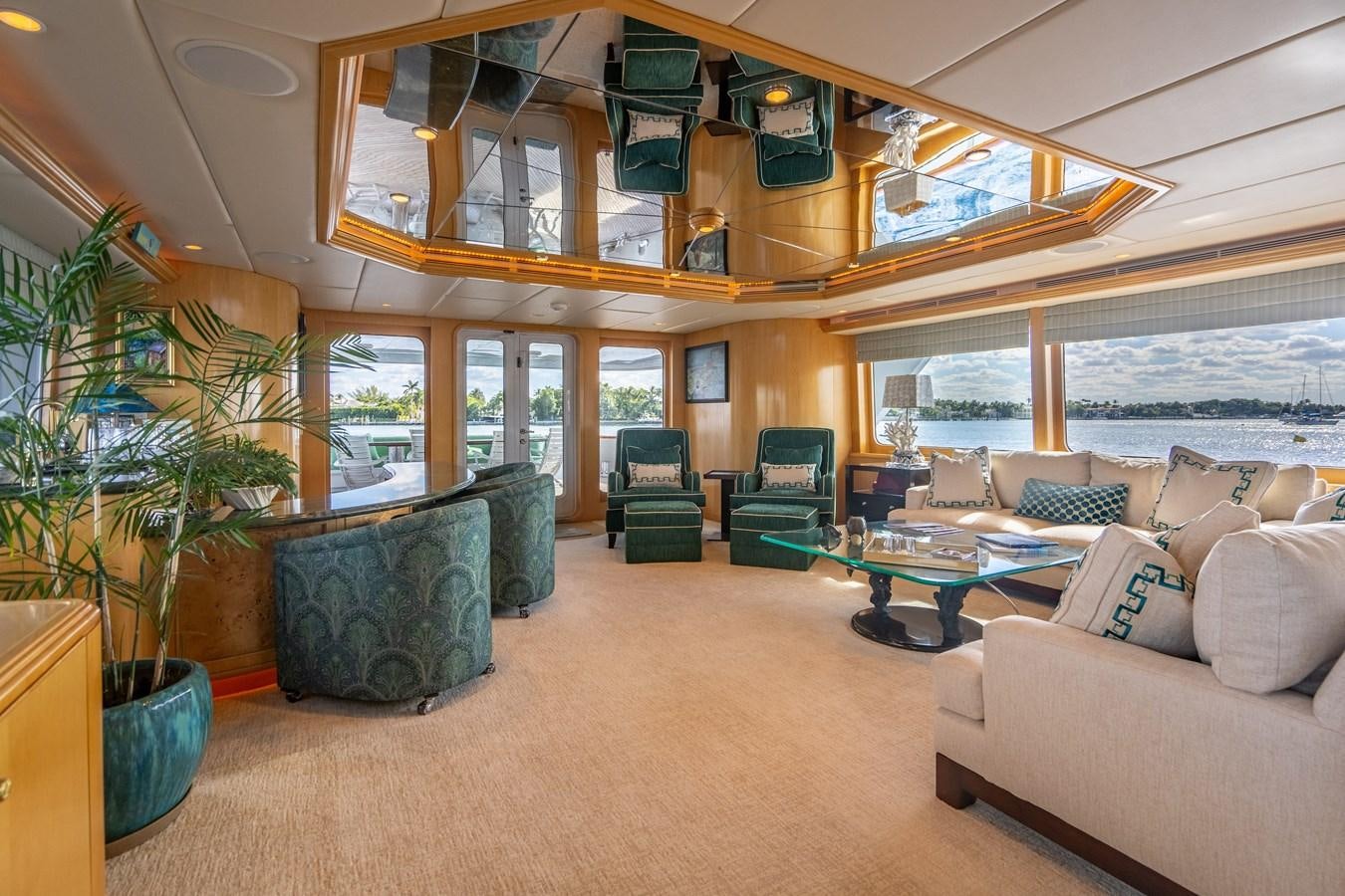 a living room with a large open window aboard SEA DREAMS Yacht for Sale