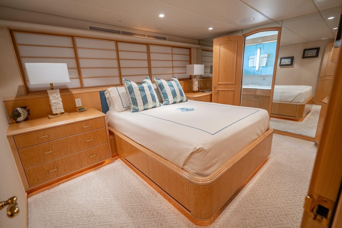 a room with a bed and a desk aboard SEA DREAMS Yacht for Sale