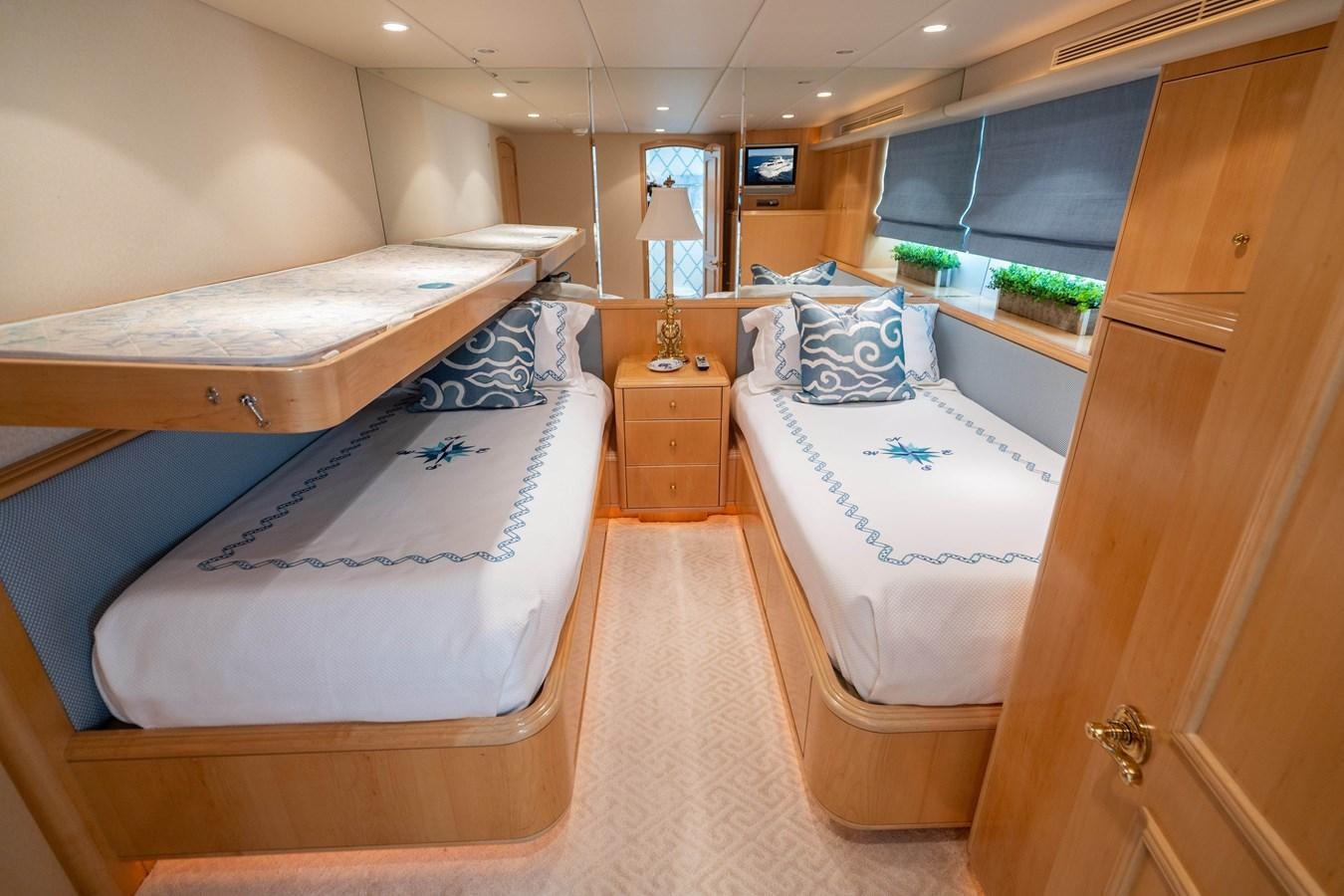 a room with beds and a window aboard SEA DREAMS Yacht for Sale