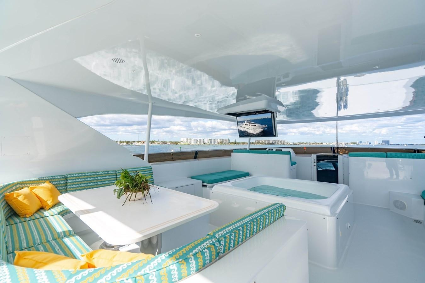 a room with a view of a snowy mountain and a pool aboard SEA DREAMS Yacht for Sale