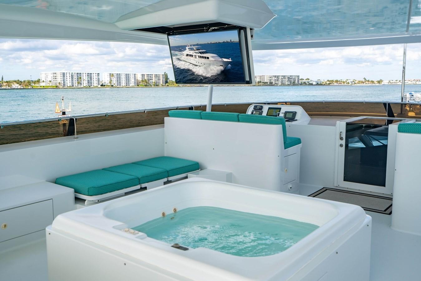 a large swimming pool in a large room with a large window aboard SEA DREAMS Yacht for Sale