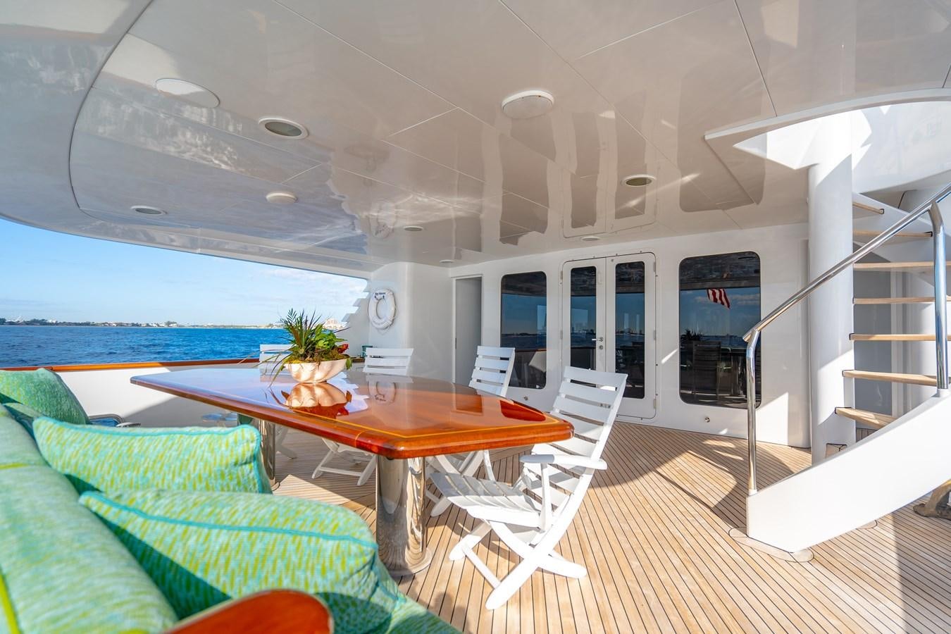 a room with a table and chairs aboard SEA DREAMS Yacht for Sale