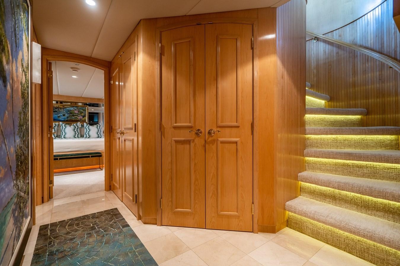 a room with wooden doors aboard SEA DREAMS Yacht for Sale