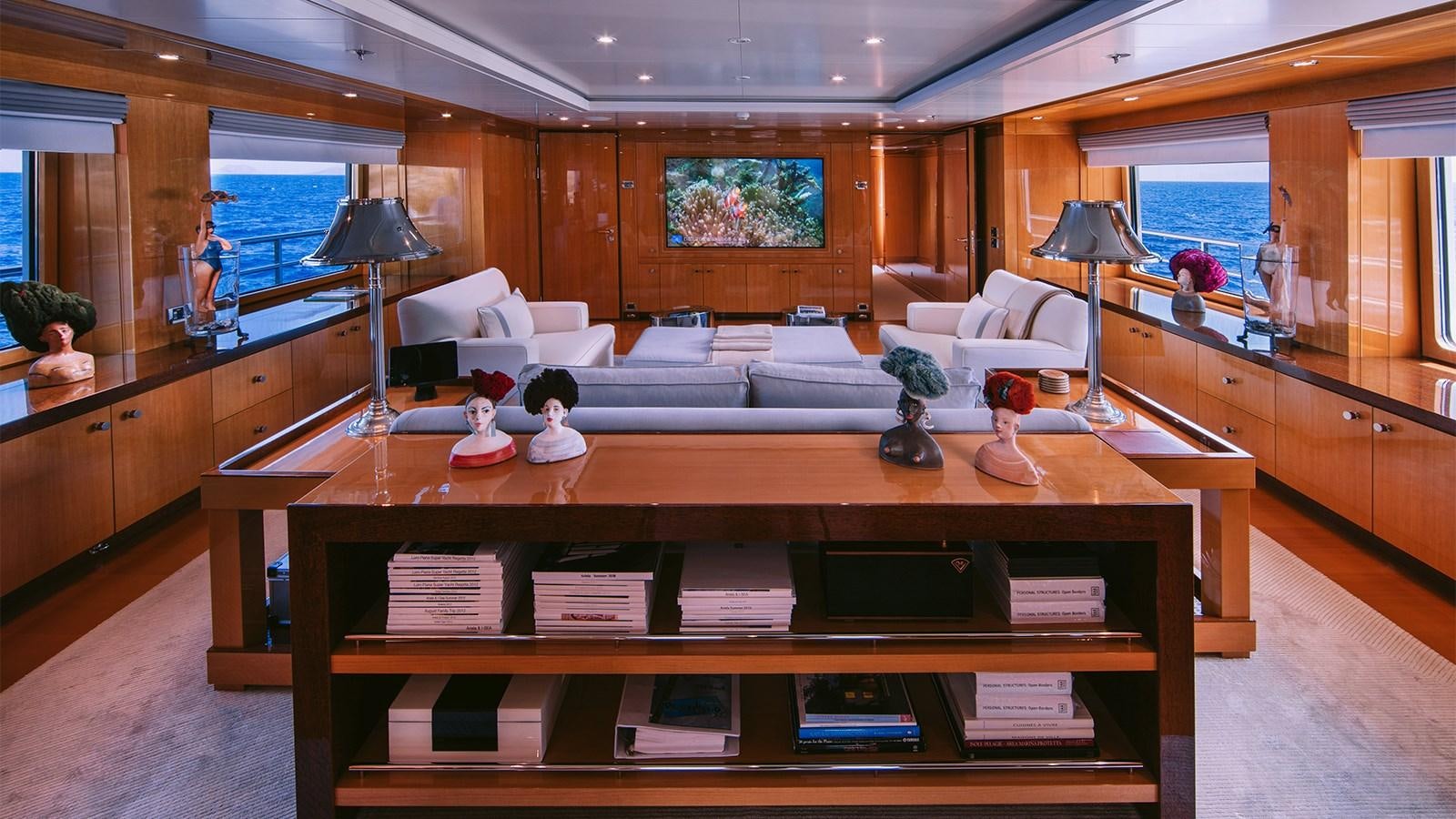 a living room with a coffee table aboard ARIELA Yacht for Sale