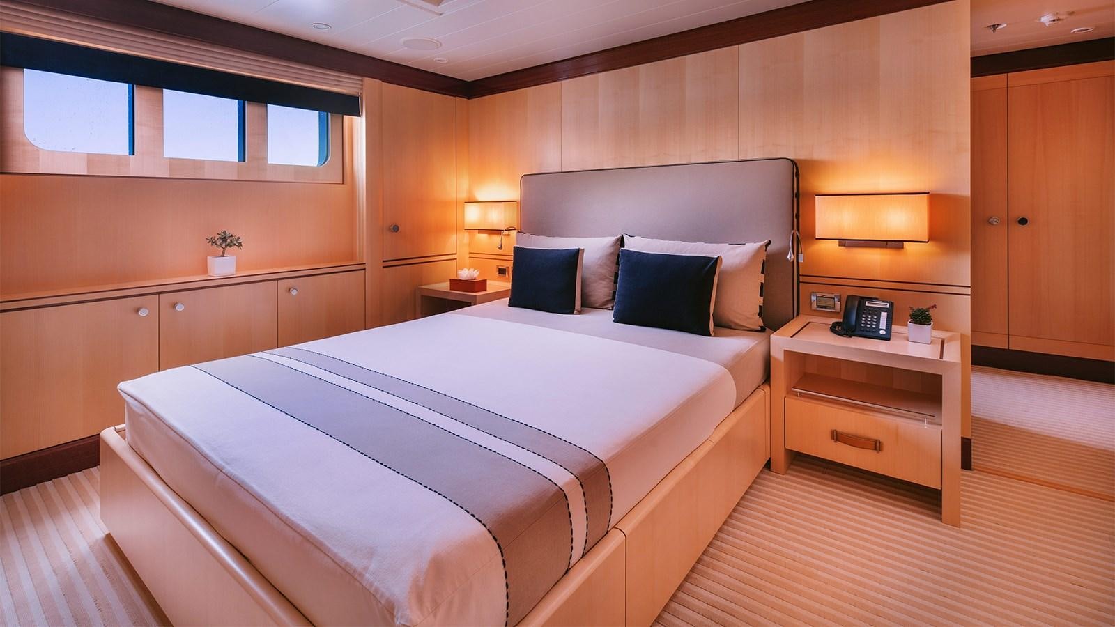 a bed in a room aboard ARIELA Yacht for Sale