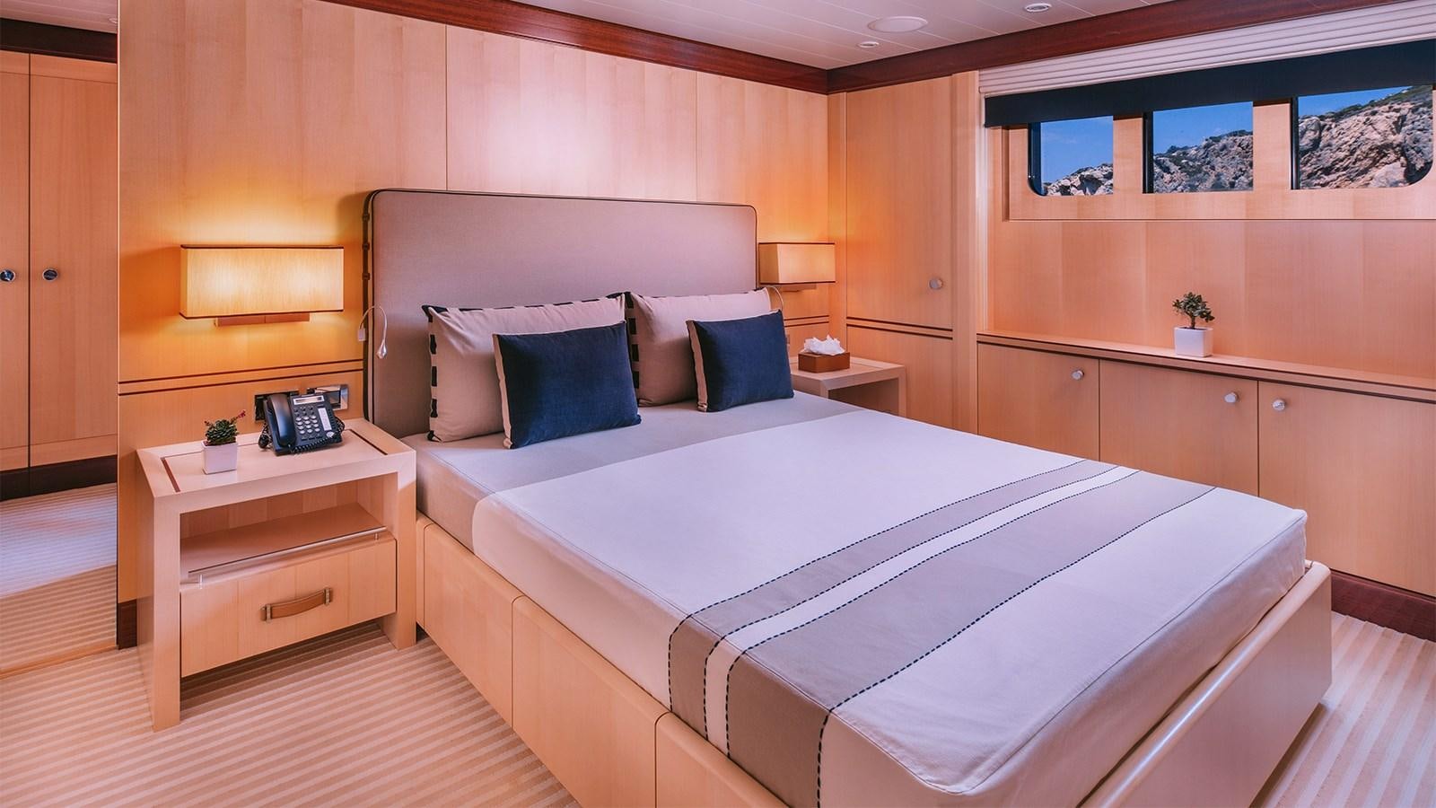 a bed in a room aboard ARIELA Yacht for Sale