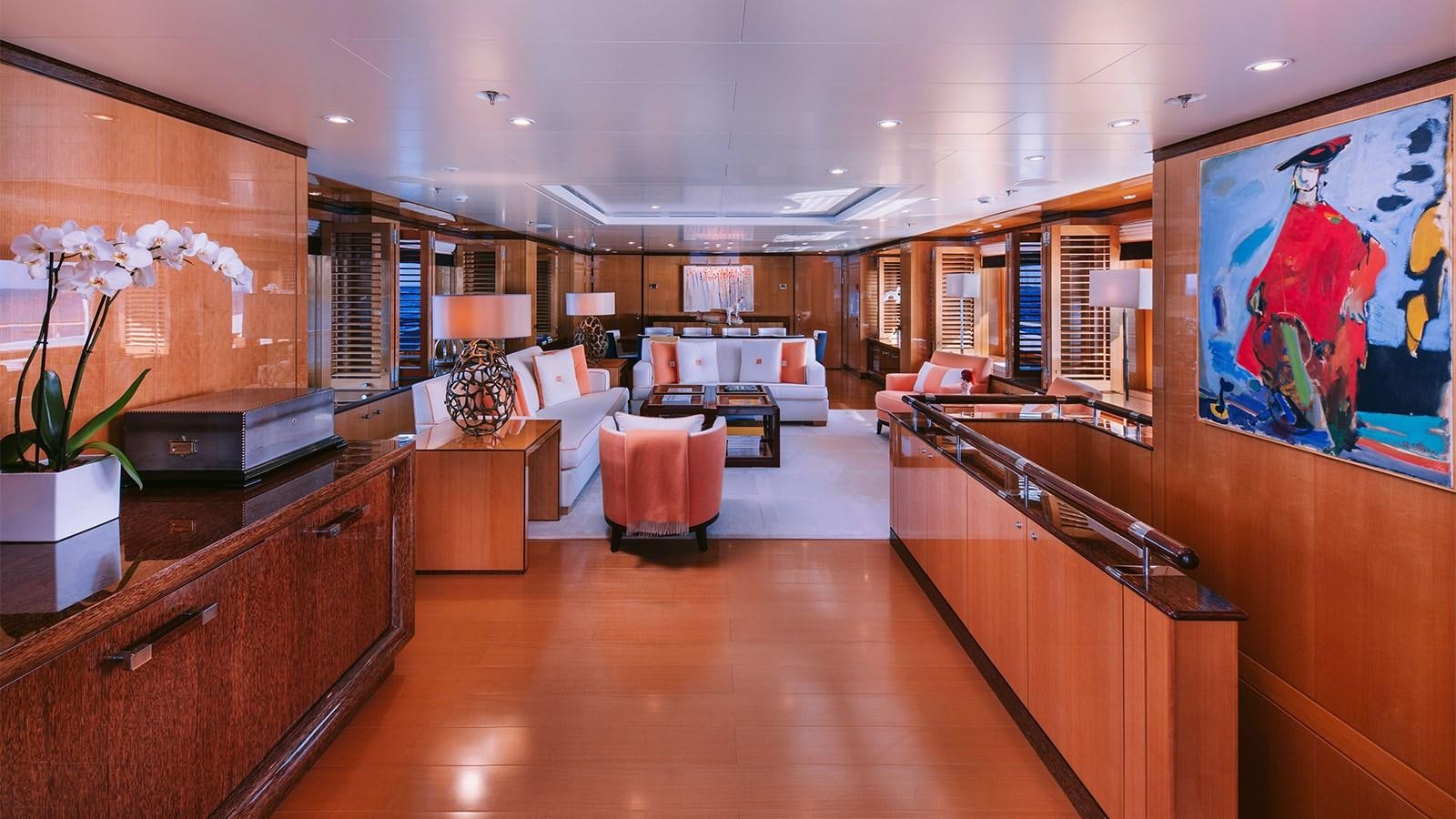 a large room with a wood floor and a large window aboard ARIELA Yacht for Sale