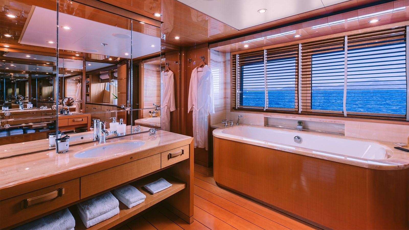 a bathroom with a large tub aboard ARIELA Yacht for Sale
