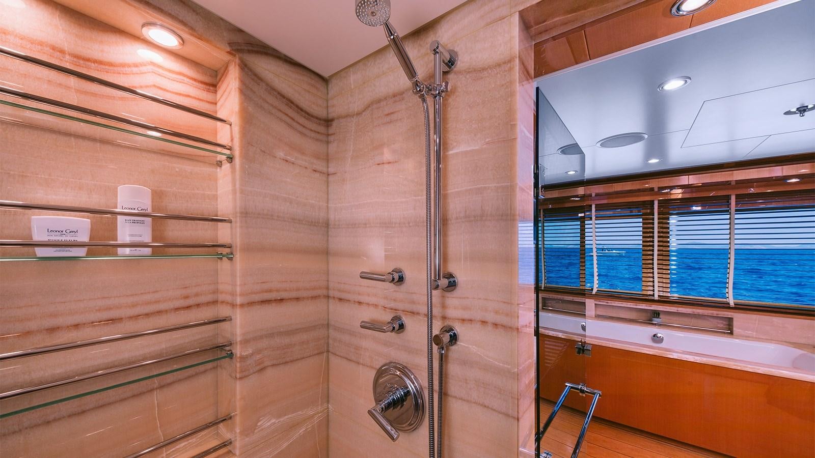 a room with a shower and a shelf aboard ARIELA Yacht for Sale
