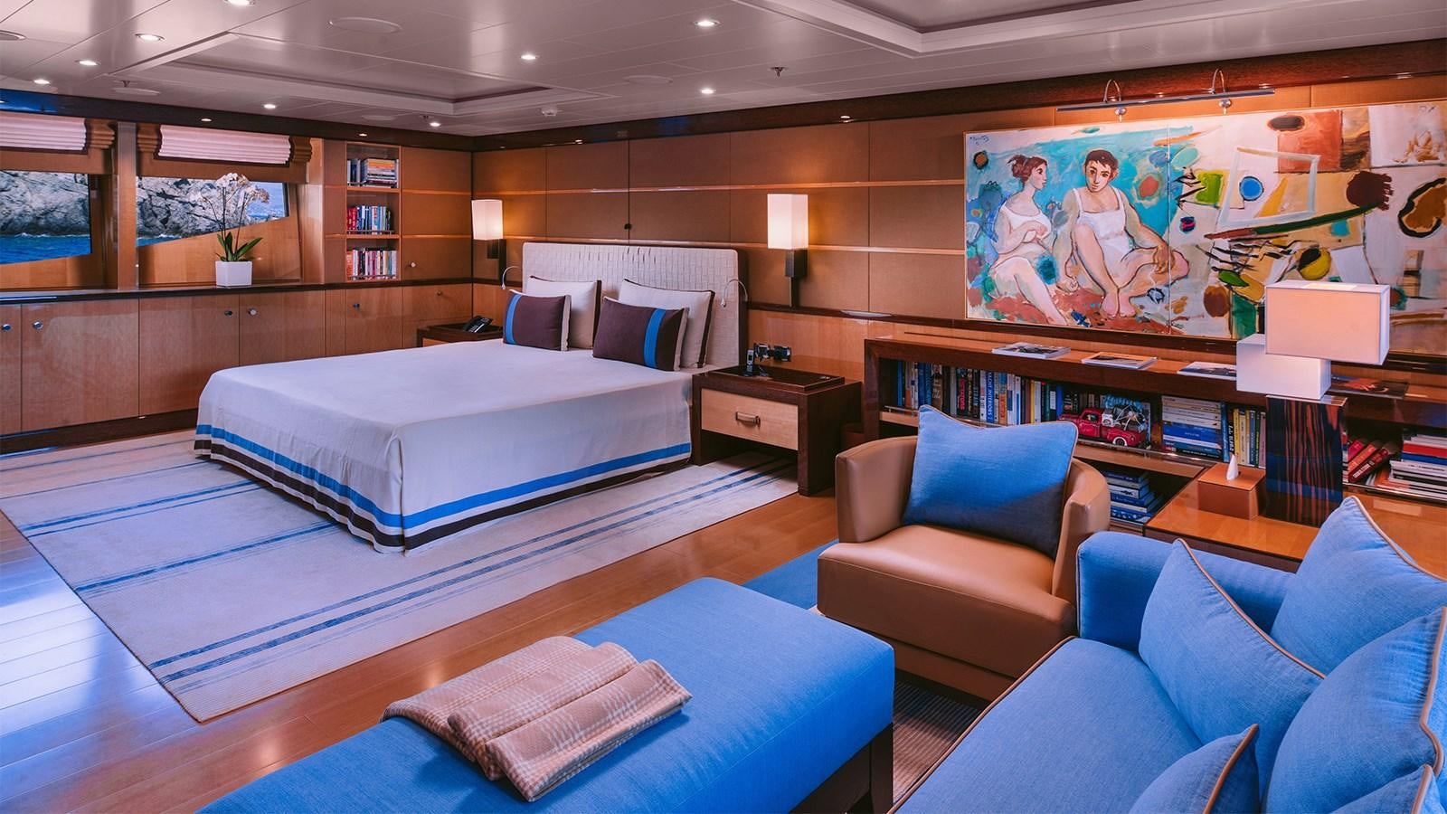 a room with a bed and a couch aboard ARIELA Yacht for Sale