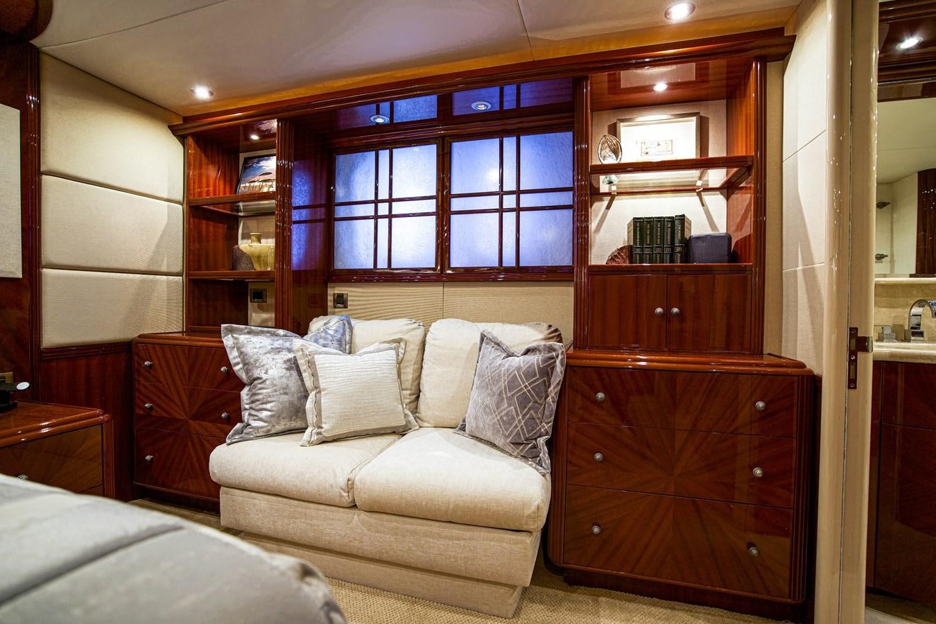 a living room with a wood cabinet aboard NEW HORIZON Yacht for Sale