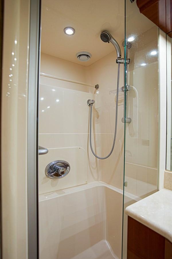 a shower with a glass door aboard NEW HORIZON Yacht for Sale