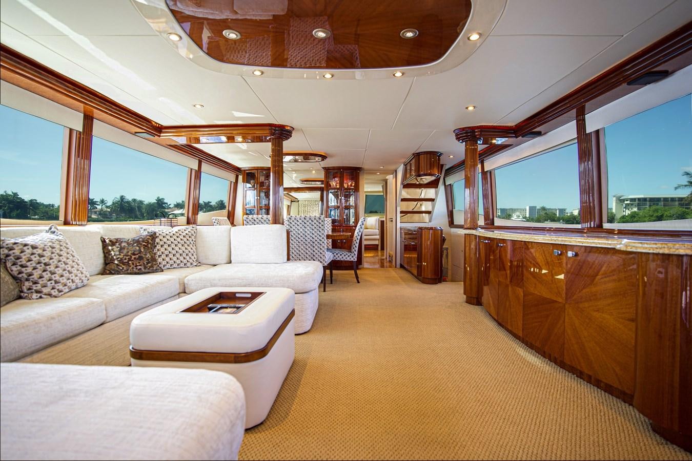 a large living room with a large window aboard NEW HORIZON Yacht for Sale