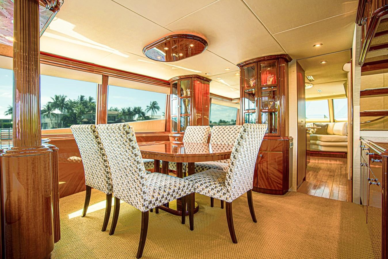 a dining room with a table and chairs aboard NEW HORIZON Yacht for Sale