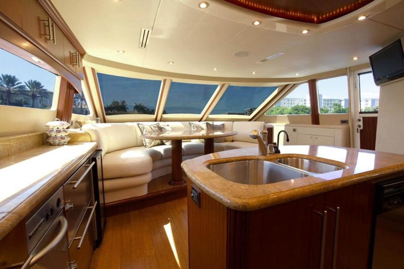 a kitchen with a sink and a couch aboard NEW HORIZON Yacht for Sale
