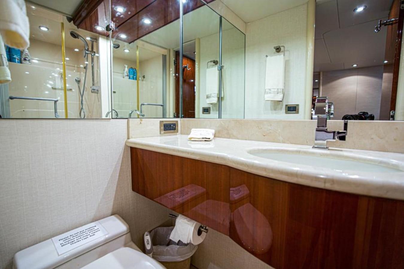 a bathroom with a large mirror aboard NEW HORIZON Yacht for Sale