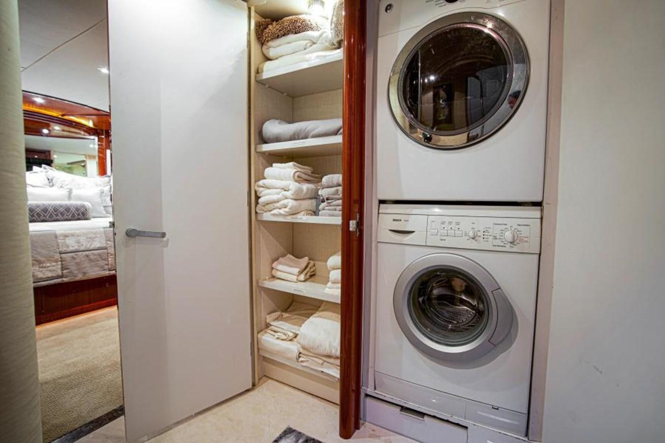 a room with a washer and dryer aboard NEW HORIZON Yacht for Sale