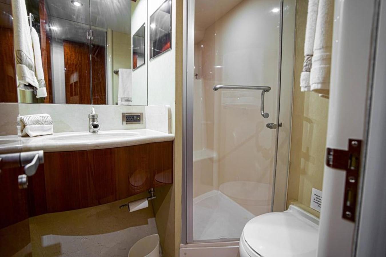 a bathroom with a glass shower aboard NEW HORIZON Yacht for Sale