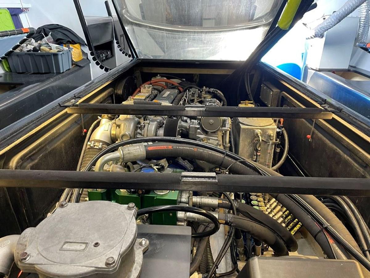 a close-up of a car engine aboard BLACK JACK IV Yacht for Sale