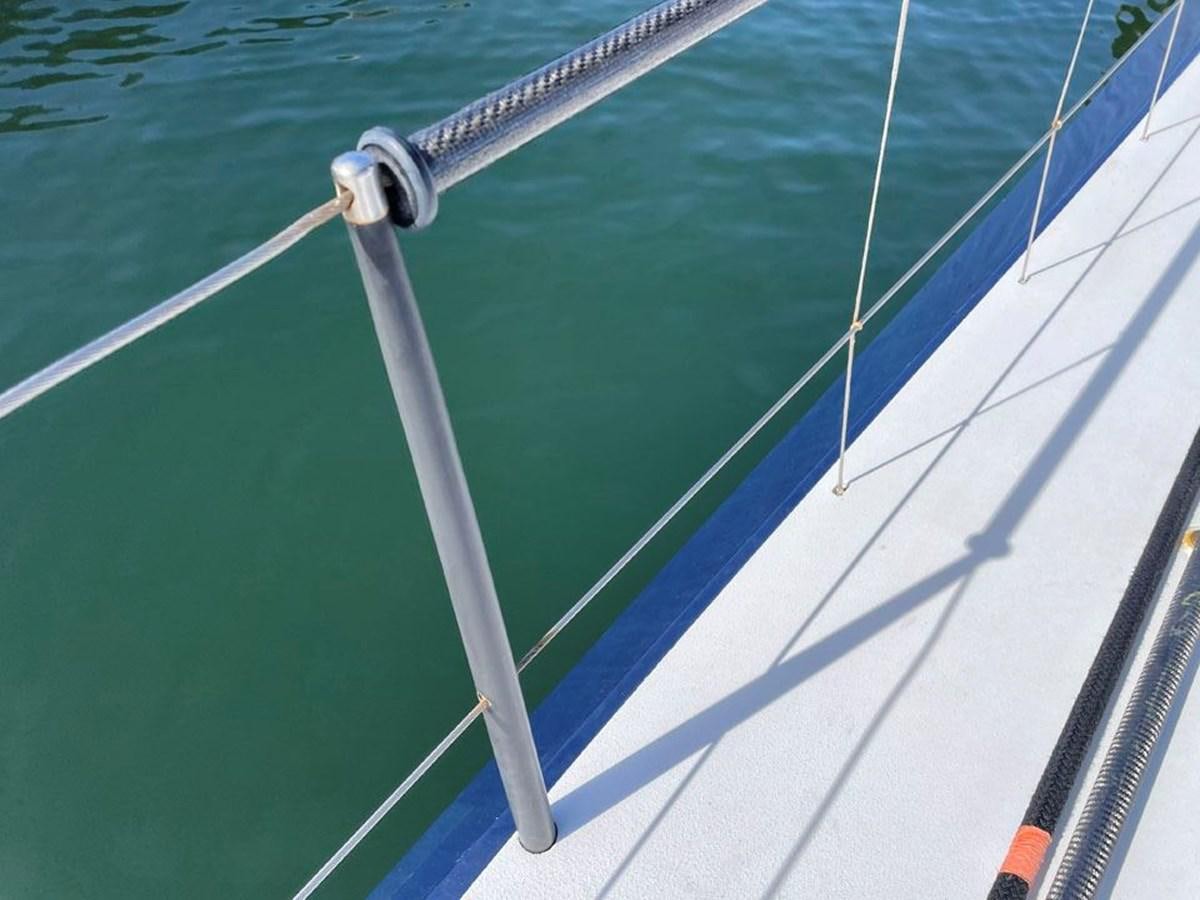 a blue boat with a white pole aboard BLACK JACK IV Yacht for Sale