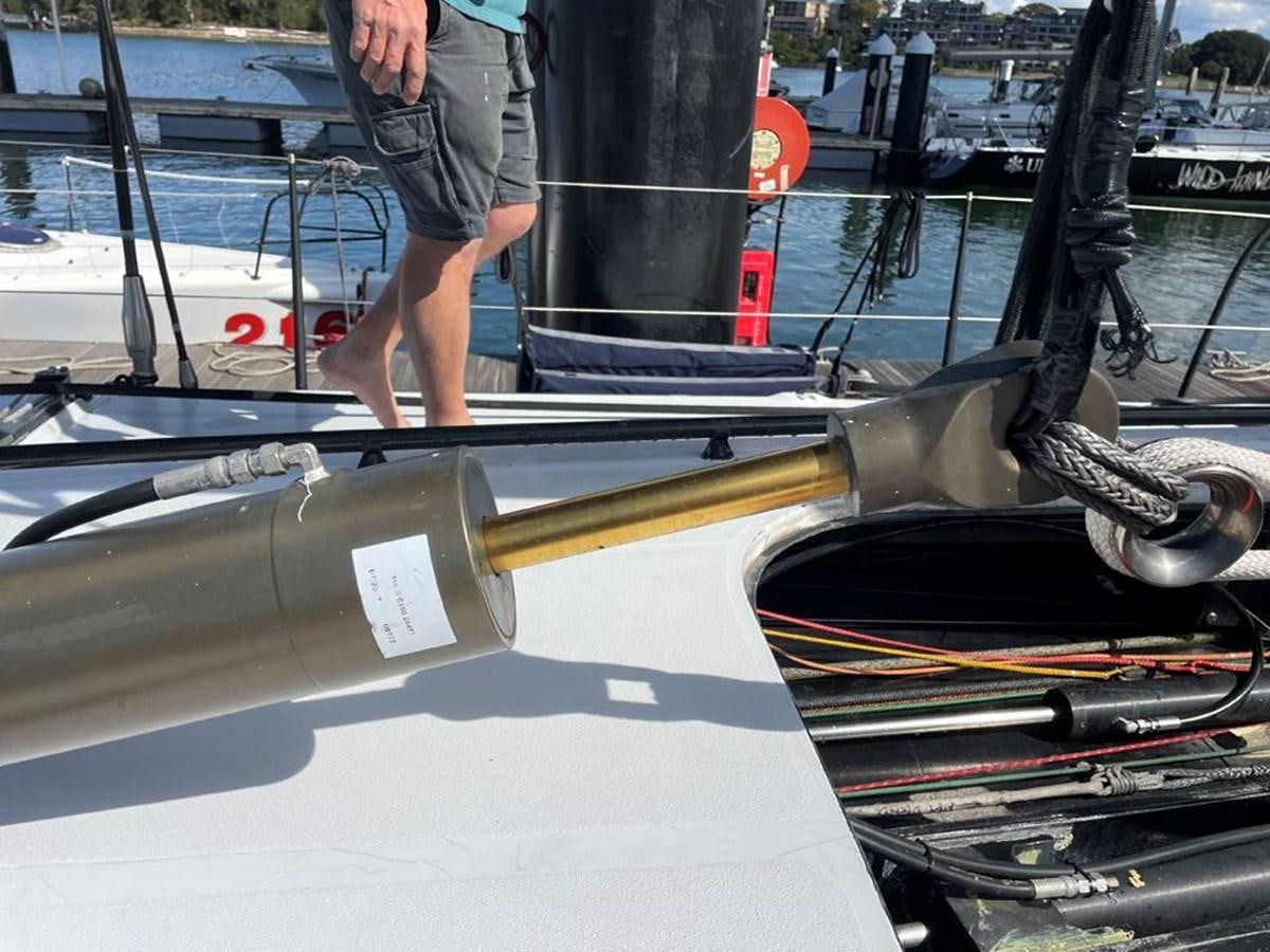 a person standing next to a boat aboard BLACK JACK IV Yacht for Sale