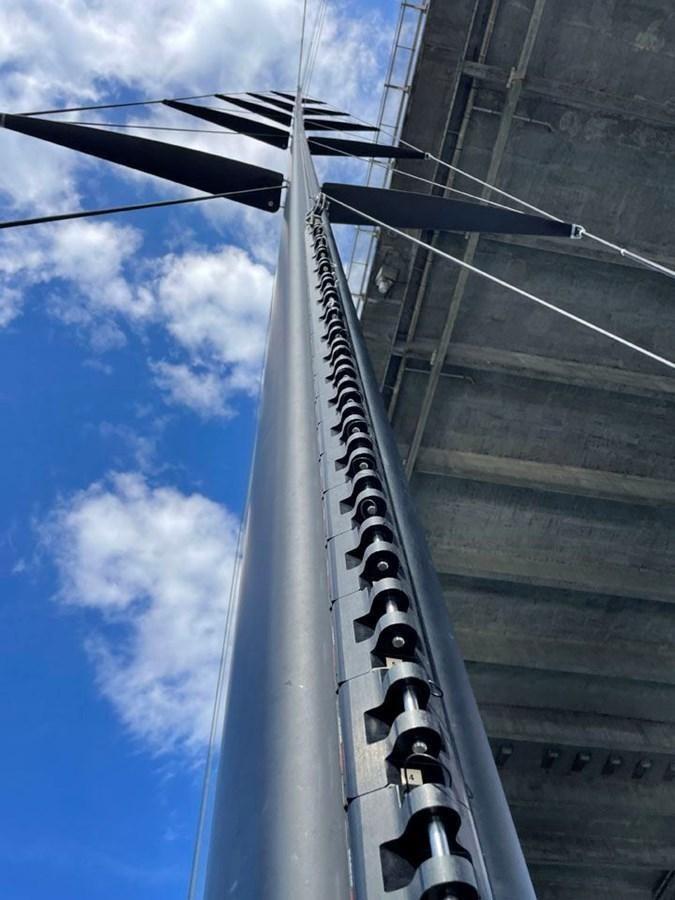 a tall building with a large metal tower aboard BLACK JACK IV Yacht for Sale