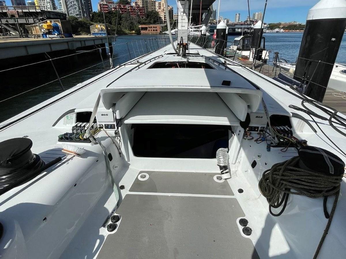 a white boat on a dock aboard BLACK JACK IV Yacht for Sale