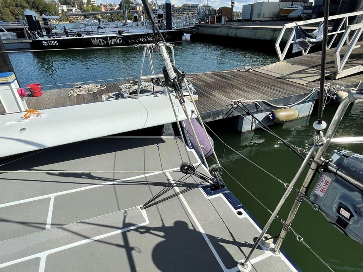 a boat docked at a pier aboard BLACK JACK IV Yacht for Sale