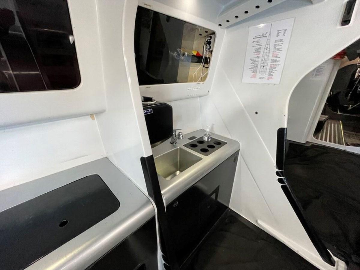 a small bathroom with a sink aboard BLACK JACK IV Yacht for Sale