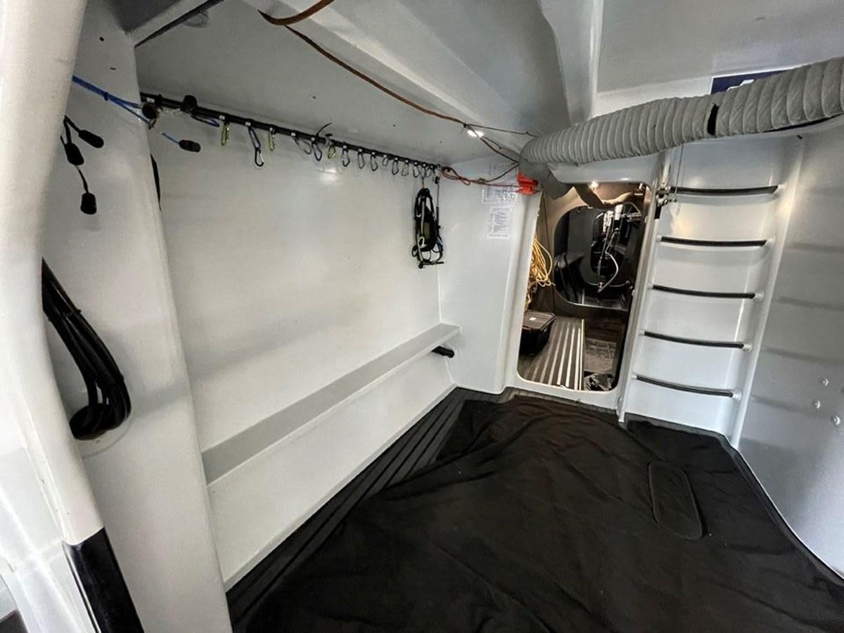 a room with a bunk bed and a ladder aboard BLACK JACK IV Yacht for Sale