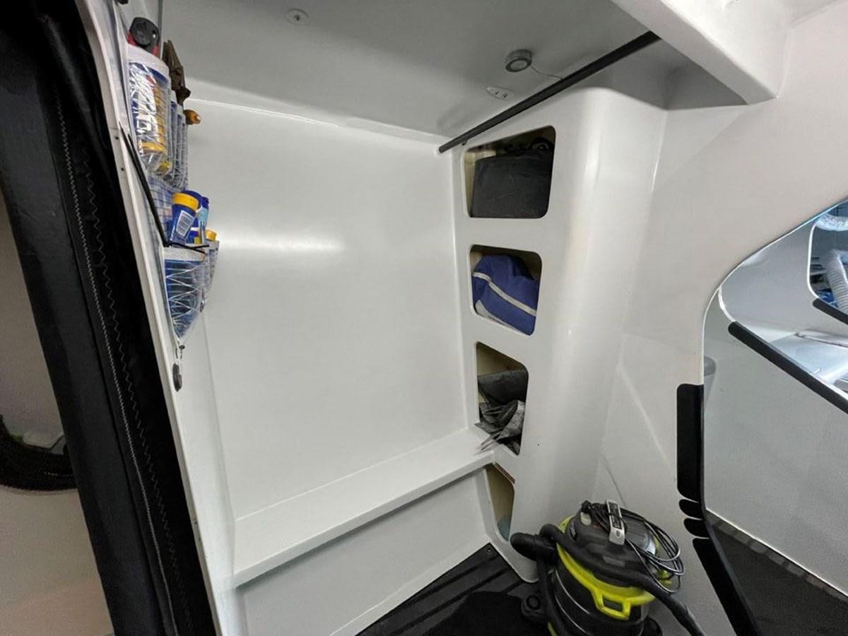 a white vehicle with a seat aboard BLACK JACK IV Yacht for Sale