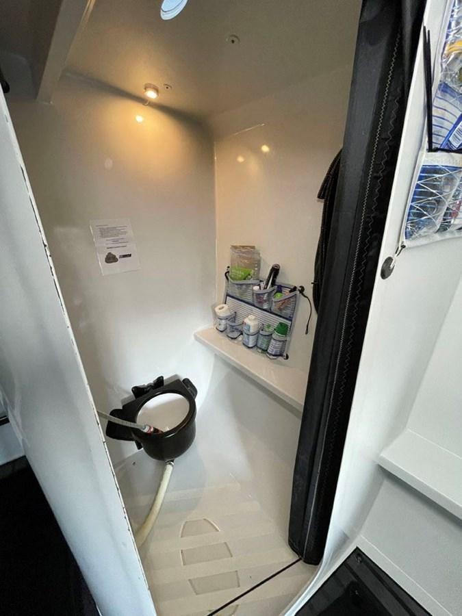 a bathroom with a small shelf aboard BLACK JACK IV Yacht for Sale