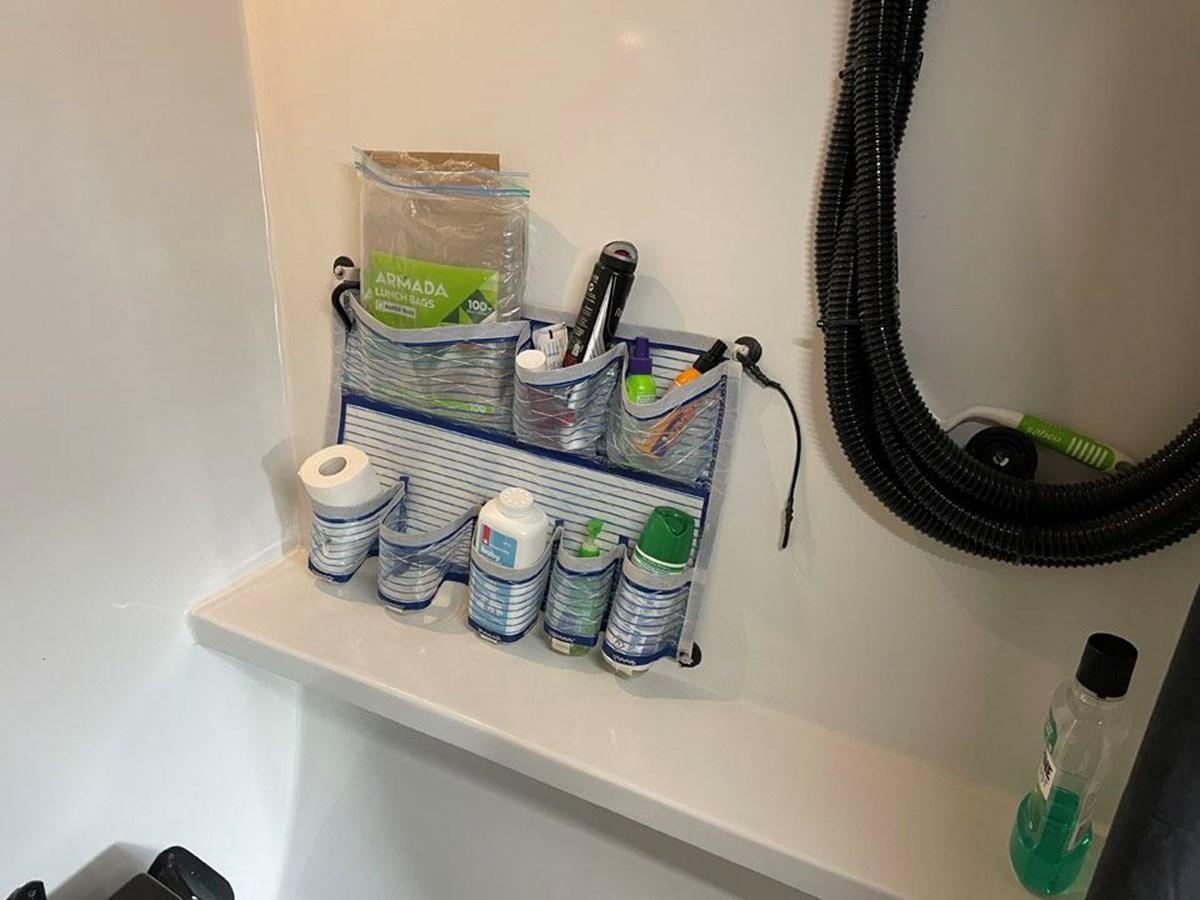 a shelf with a variety of items on it aboard BLACK JACK IV Yacht for Sale