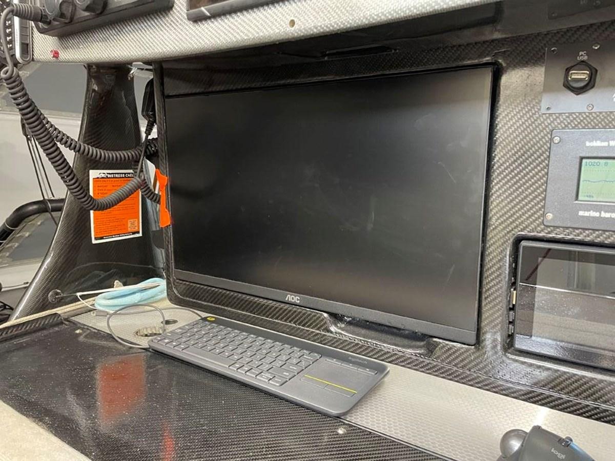 a computer with a screen and a keyboard aboard BLACK JACK IV Yacht for Sale