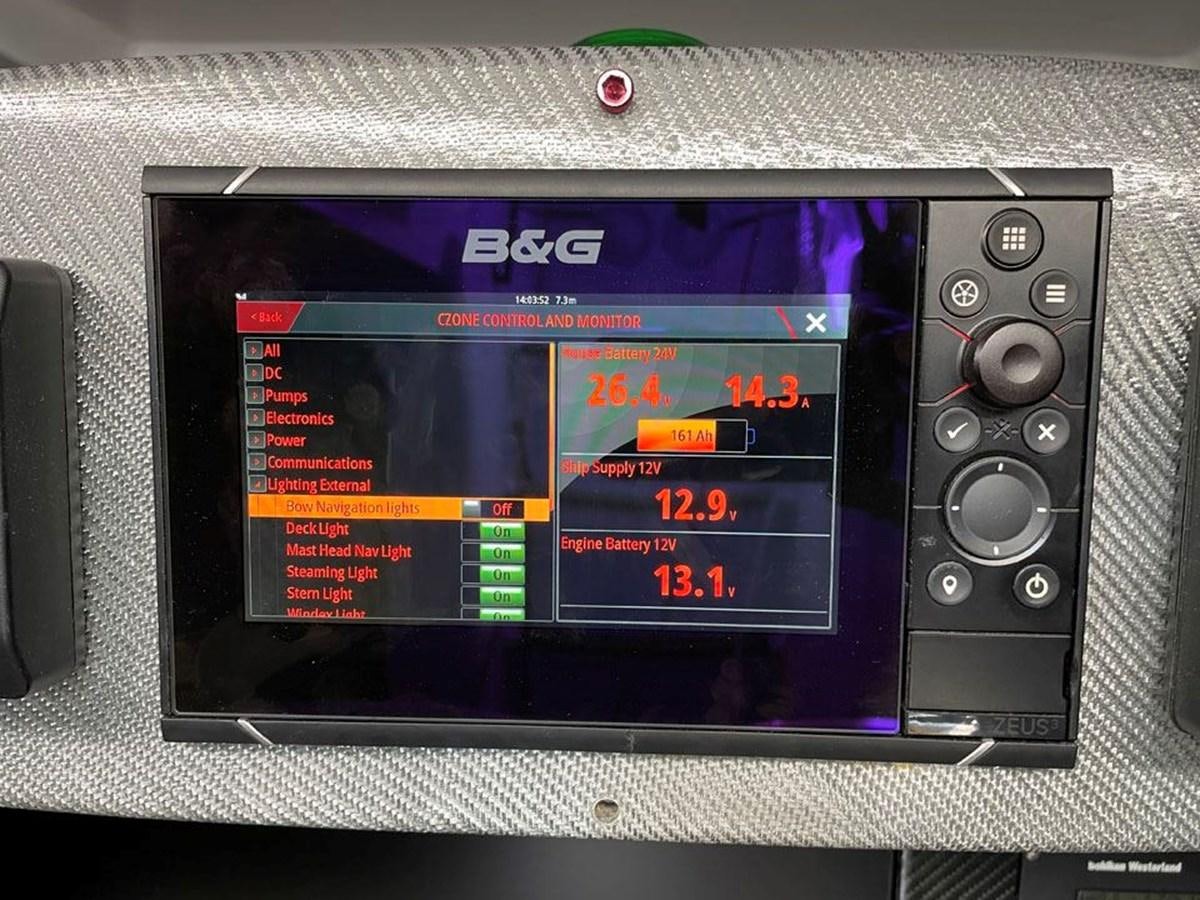 a rectangular electronic device aboard BLACK JACK IV Yacht for Sale