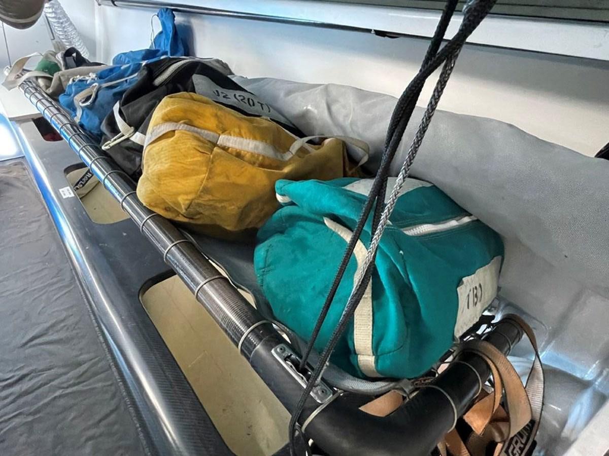 a car with luggage on the back aboard BLACK JACK IV Yacht for Sale