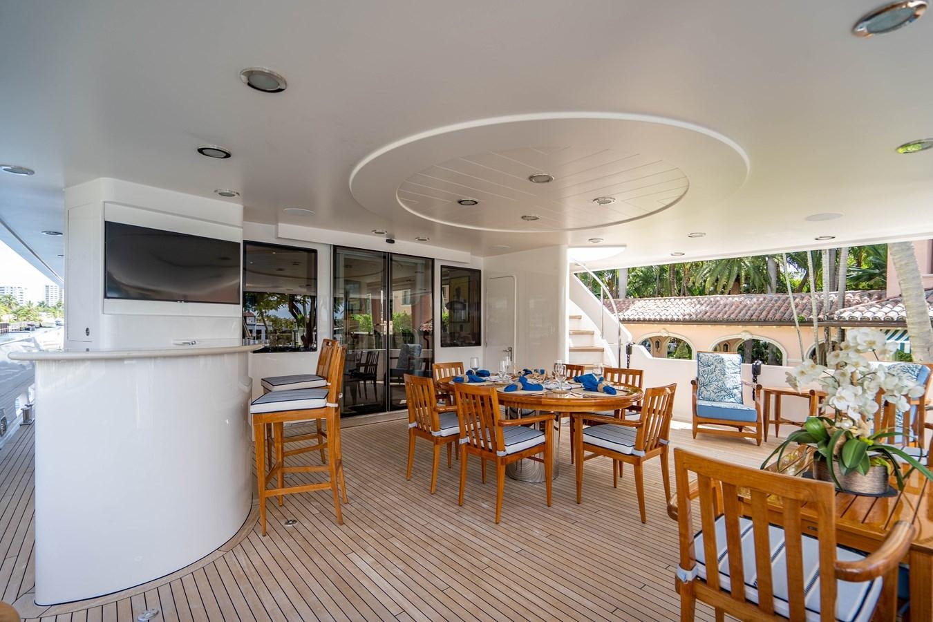 a large open kitchen and dining area aboard YOLO Yacht for Sale