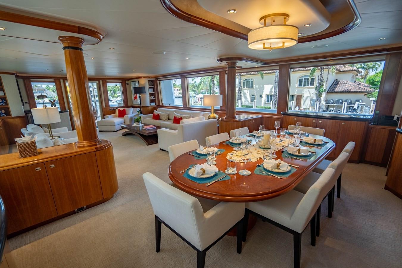 a large dining room with a large table and chairs aboard YOLO Yacht for Sale