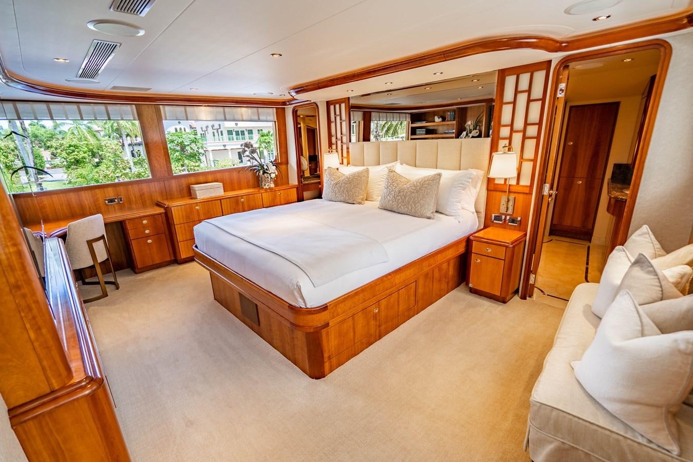 a large bedroom with a large bed aboard YOLO Yacht for Sale