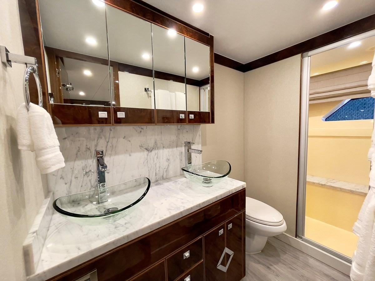 a bathroom with a sink and a mirror aboard NEW BOAT WITH FULL WARRANTIES Yacht for Sale