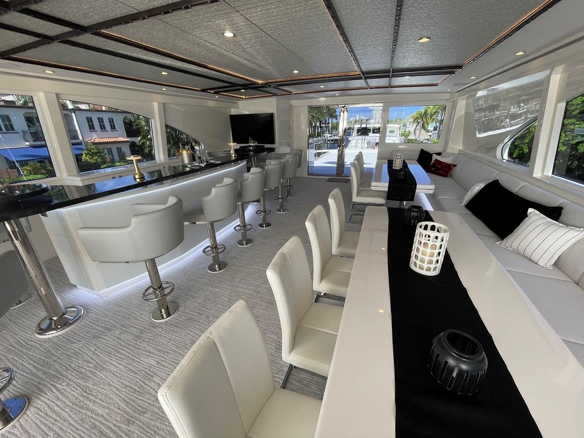 a room with a table chairs and a large window aboard NEW BOAT WITH FULL WARRANTIES Yacht for Sale