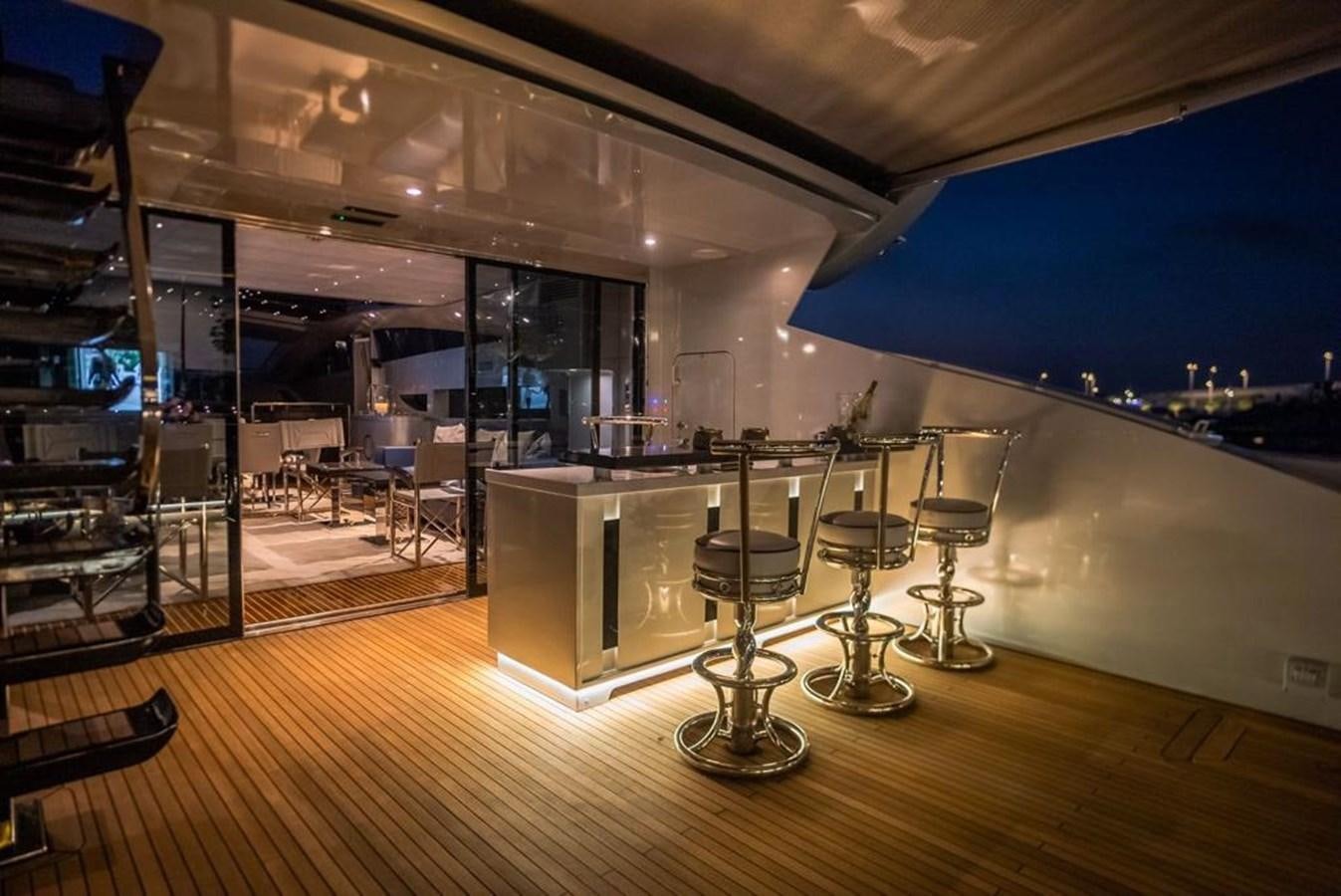 a room with tables and chairs aboard LADY MAIA Yacht for Sale